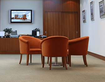 A clean office meeting room with a clean carpet