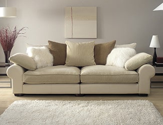A clean white couch, benefiting from upholstery cleaning services provided by Atlas Cleaning Services